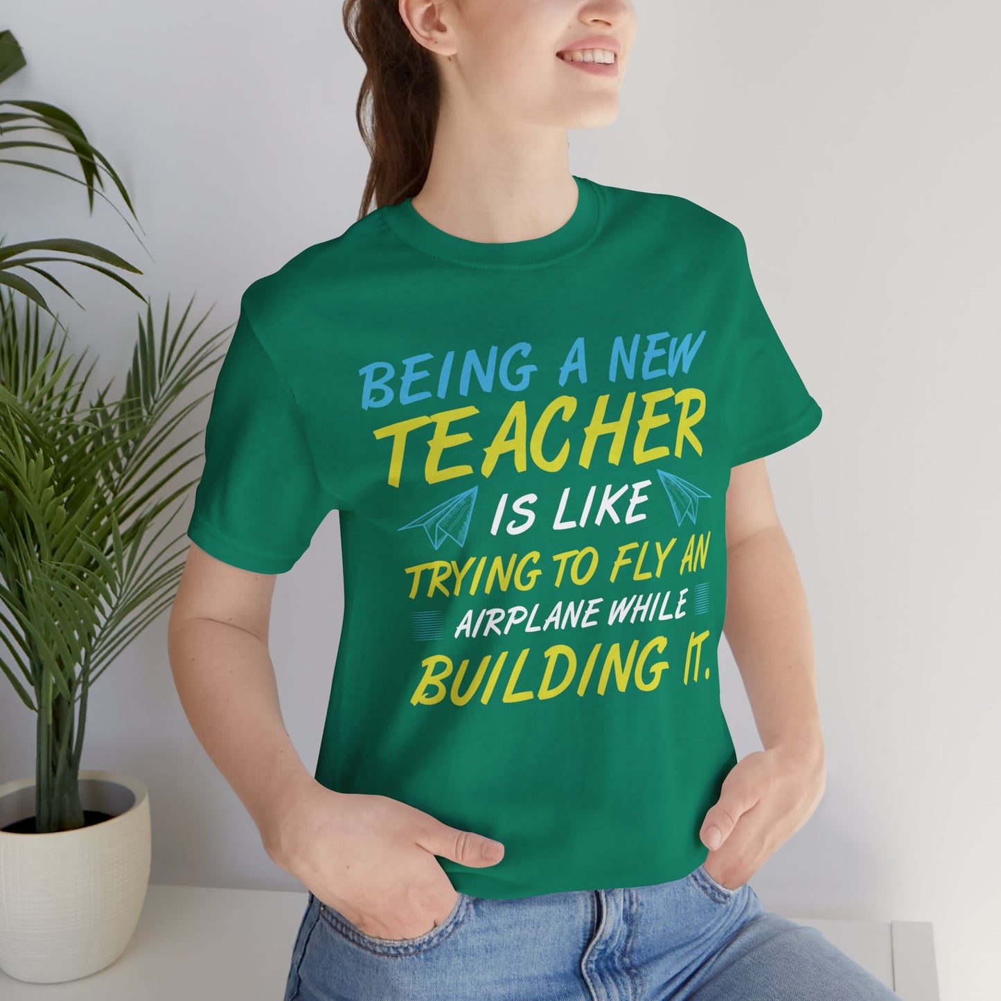 Being A New Teacher Is Like Trying  To Fly An Airplane While Building It - Unisex Jersey Short Sleeve Tee